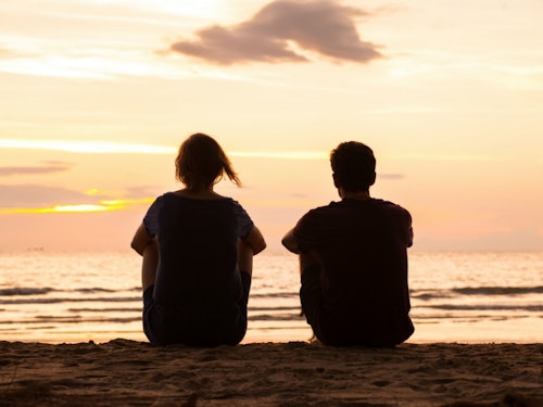 two people at sunset on the beach